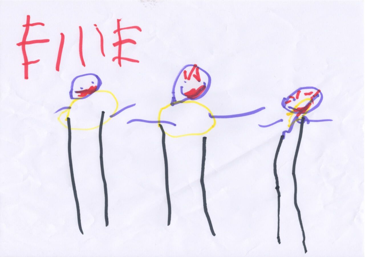 A family portrait drawn by my daughter, Ellie. The three of us have yellow circles for torsos, black stick legs, purple stick arms, and purple faces. There is red lipstick drawn on all our lips. In the top left hand corner Ellie has written her name in large letters with a red pen.
